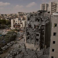 Israeli soldiers and rescue team work amid the rubble of residential buildings destroyed by an Iranian missile strike that killed several people, in Beersheba, Israel, June 24, 2025. (AP Photo/Leo Correa)
