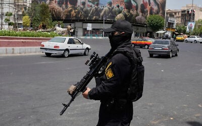A member of Iran's Islamic Revolutionary Guard Corps stands guard at Enqelab-e-Eslami (Islamic Revolution) square in downtown Tehran, June 24, 2025. (AP Photo/Vahid Salemi) A member of Iran's Islamic Revolutionary Guard Corps stands guard at Enqelab-e-Eslami (Islamic Revolution) square in downtown Tehran, June 24, 2025. (AP Photo/Vahid Salemi)