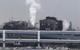 Smoke billows from an oil refinery in Kawasaki, southwest of Tokyo, Japan, October 21, 2013. (AP Photo/Koji Sasahara, File)
