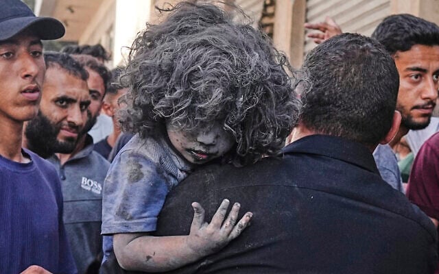 A Palestinian man carries a wounded child after an Israeli strike on a residential building in Gaza City, Friday, June 27, 2025. (AP Photo/Jehad Alshrafi) A Palestinian man carries a wounded child after an Israeli strike on a residential building in Gaza City, Friday, June 27, 2025. (AP Photo/Jehad Alshrafi)