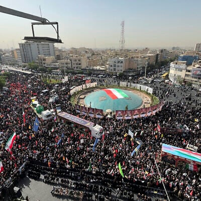 Mourners gather in Enghelab Square to attend the funeral ceremony of the Iranian army generals, nuclear scientists and their family members who were killed in Israeli strikes, in Tehran, Iran, June 28, 2025. (AP Photo/Vahid Salemi)