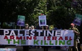 Protesters of the Palestine Solidarity Campaign against the tournament's sponsor Barclays gather outside the Wimbledon Tennis Championships in London, June 30, 2025. (AP Photo/ Alastair Grant)