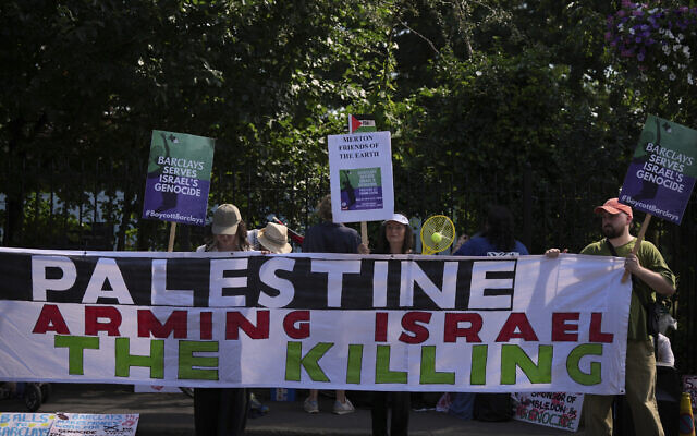 Protesters of the Palestine Solidarity Campaign against the tournament's sponsor Barclays gather outside the Wimbledon Tennis Championships in London, June 30, 2025. (AP Photo/ Alastair Grant) Protesters of the Palestine Solidarity Campaign against the tournament's sponsor Barclays gather outside the Wimbledon Tennis Championships in London, June 30, 2025. (AP Photo/ Alastair Grant)