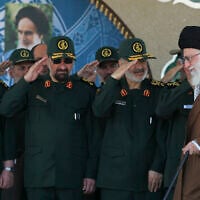 Iran's Supreme Leader Ayatollah Ali Khamenei, right, arrives at a graduation ceremony of Islamic Revolutionary Guard Corps officers, May 20, 2015. (Office of the Iranian Supreme Leader via AP)