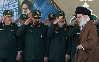Iran's Supreme Leader Ayatollah Ali Khamenei, right, arrives at a graduation ceremony of Islamic Revolutionary Guard Corps officers, May 20, 2015. (Office of the Iranian Supreme Leader via AP)