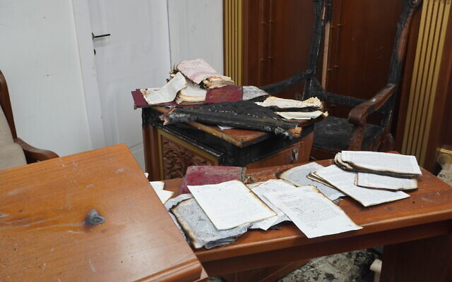 Books and former chief rabbi Yitzhak Yosef's chair, that were burnt in an arson attack at the Or Habib synagogue in Jerusalem's Sanhedria neighborhood on June 8, 2025. (Charlie Summers/Times of Israel Books and former chief rabbi Yitzhak Yosef's chair, that were burnt in an arson attack at the Or Habib synagogue in Jerusalem's Sanhedria neighborhood on June 8, 2025. (Charlie Summers/Times of Israel