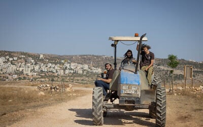 Jewish settlers at the illegal West Bank outpost of Ramat Migron, September 8, 2023. (Chaim Goldberg/Flash90)