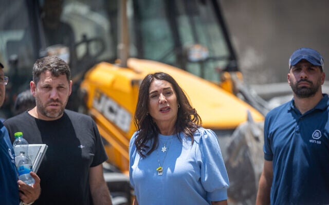 Transportation Minister Miri Regev visits the scene where a ballistic missile fired from Iran hit and caused damage in Beersheba, June 24, 2025 (Yonatan Sindel/Flash90)
