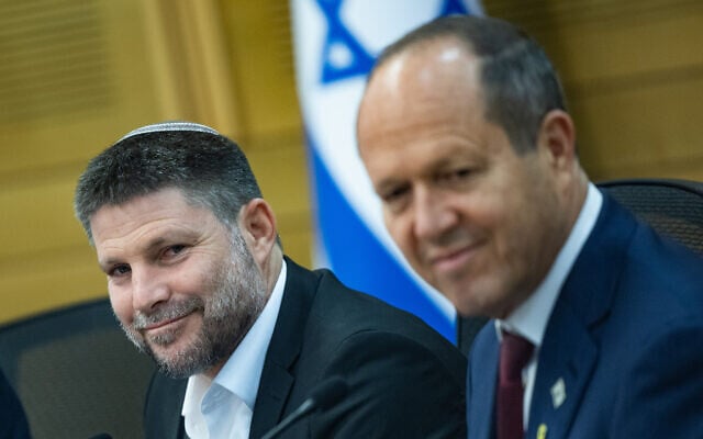 Finance Minister Bezalel Smotrich and Economy Minister Nir Barkat attend a Knesset Health Committee meeting, in Jerusalem, on July 17, 2024. (Yonatan Sindel/Flash90)
