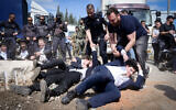 Demonstrators clash with police during a protest against the conscription of ultra-Orthodox Jews outside the IDF Recruitment Center at Tel Hashomer, April 28, 2025 (Avshalom Sassoni/Flash90)