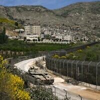 Israeli forces on the border fence with Syria, in the northern Israeli town of Majdal Shams, in the Golan Heights, May 9, 2025. (Michael Giladi/FLash90)