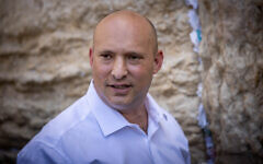 Former prime minister Naftali Bennett visits at the Western Wall in Jerusalem's Old City, May 26, 2025. (Yonatan Sindel/Flash90)