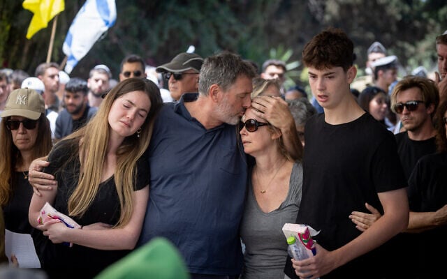 Friends and family attend the funeral of Staff Sgt. Yoav Raver (19) at Sde Warburg in central Israel on June 8, 2025. (Chaim Goldberg/Flash90) Friends and family attend the funeral of Staff Sgt. Yoav Raver (19) at Sde Warburg in central Israel on June 8, 2025. (Chaim Goldberg/Flash90)