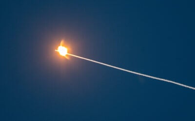 Smoke trails and an explosion seen after a missile fired from Yemen was intercepted, as seen from Jerusalem, June 10, 2025. (Yonatan Sindel/Flash90)
