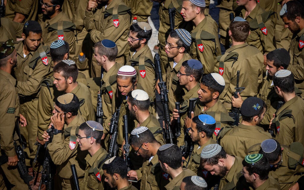 Soldiers from the ultra-Orthodox Netzah Yehuda Battalion seen before a swearing in ceremony at the Western Wall in Jerusalem's Old City, June 11, 2025. (Chaim Goldberg/Flash90)