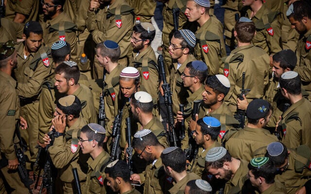 Soldiers from the ultra-Orthodox Netzah Yehuda Battalion seen before a swearing in ceremony at the Western Wall in Jerusalem's Old City, June 11, 2025. (Chaim Goldberg/Flash90)