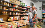 Israelis shop for food in Tel Aviv, as the country braces for an Iranian response to Israel's attacks on the Islamic Republic's nuclear program, on June 13, 2025. (Michael Giladi/FLASH90)