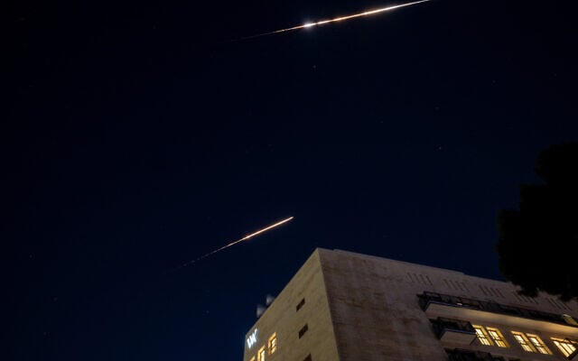 File: Interception from a missile attack on Israel fired from Iran, as seen from Jerusalem, early on June 14, 2025. (Yonatan SIndel/Flash90)