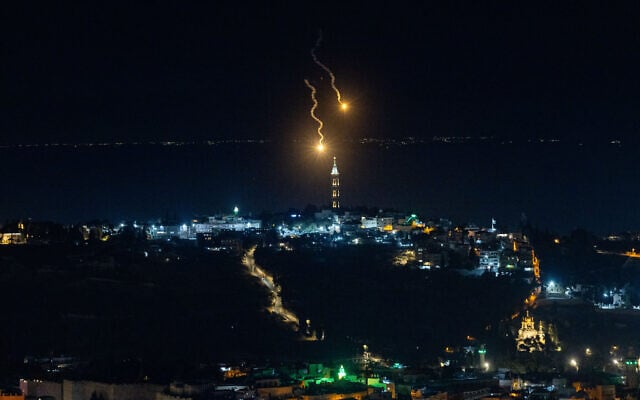Shrapnel is seen falling over East Jerusalem on June 16, 2025. (Yonatan Sindel/Flash90)