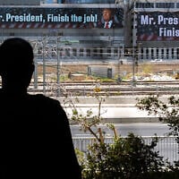 A message addressed to US President Donald Trump reading, 'Mr. President, finish the job,' is pictured in Tel Aviv on June 18, 2025. It is unclear who paid for the banner (Chaim Goldberg/Flash90)