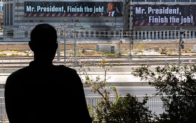 A message addressed to US President Donald Trump reading, 'Mr. President, finish the job,' is pictured in Tel Aviv on June 18, 2025. It is unclear who paid for the banner (Chaim Goldberg/Flash90)