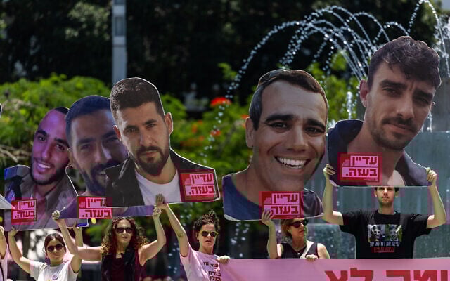 Protesters call for a deal to secure the release of hostages held captive by Hamas in Gaza, at Dizengoff Square in Tel Aviv, June 18, 2025. (Chaim Goldberg/Flash90)