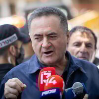 Defense Minister Israel Katz speaks to press at the site of where a missile fired from Iran struck the central city of Holon on June 19, 2025. Several Israelis were wounded, some of them badly, in the strike. (Chaim Goldberg/Flash90)