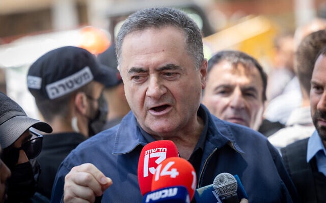 Defense Minister Israel Katz speaks to press at the site of where a missile fired from Iran struck the central city of Holon on June 19, 2025. Several Israelis were wounded, some of them badly, in the strike. (Chaim Goldberg/Flash90)