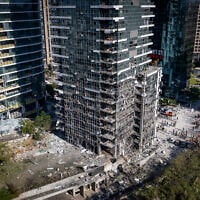 Israeli security and rescue forces at the scene where a ballistic missile fired from Iran hit Ramat Gan, June 19, 2025. (Chaim Goldberg/Flash90)