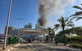 Smoke rises from where a ballistic missile fired from Iran hit Soroka Medical Center in Beersheba, June 19, 2025 (Credit: Dudu Greenspan/Flash90)