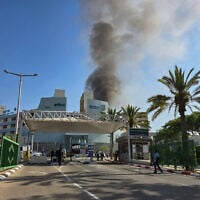 Smoke rises from where a ballistic missile fired from Iran hit Soroka Medical Center in Beersheba, June 19, 2025 (Credit: Dudu Greenspan/Flash90)