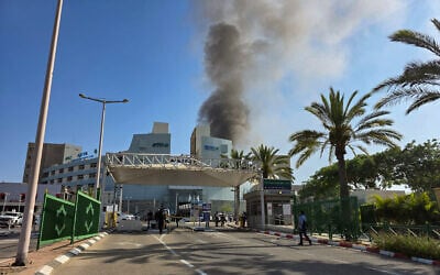 Smoke rises from where a ballistic missile fired from Iran hit Soroka Medical Center in Beersheba, June 19, 2025. (Dudu Greenspan/Flash90)