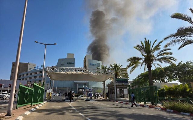 Smoke rises from where a ballistic missile fired from Iran hit Soroka Medical Center in Beersheba, June 19, 2025. (Dudu Greenspan/Flash90)