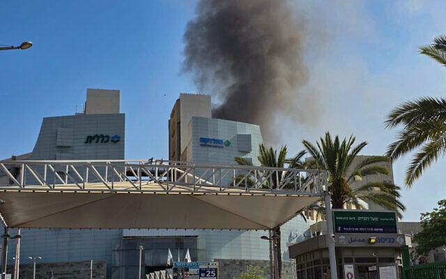 Smoke rises after an Iranian missile strike on Beersheba's Soroka Medical Center, June 19, 2025 (Dudu Greenspan/Flash90)