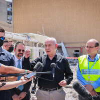 Prime Minister Benjamin Netanyahu at the scene of an Iranian missile strike on Soroka Medical Center in Beersheba, June 19, 2025. (Marc Israel Sellem/POOL/Flash90)