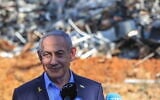 Prime Minister Benjamin Netanyahu visits the scene where an Iranian ballistic missile impacted, causing damage at the Weizmann Institute in Rehovot, June 20, 2025. (Itai Ron/Pool via Flash90)