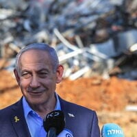 Prime Minister Benjamin Netanyahu visits the scene where an Iranian ballistic missile impacted, causing damage at the Weizmann Institute in Rehovot, June 20, 2025. (Itai Ron/Pool via Flash90)