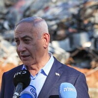 Prime Minister Benjamin Netanyahu visits the site of an Iranian ballistic missile impact at the Weizmann Institute in Rehovot, June 20, 2025. (Itai Ron/Pool/Flash90)