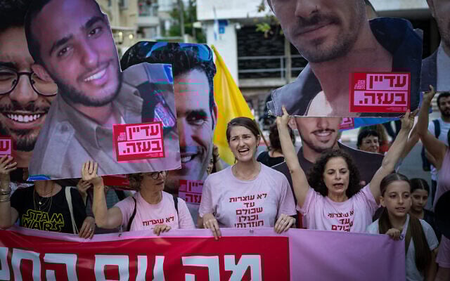 Relatives of Israelis held hostage by Hamas in Gaza and supporters protest for their release, outside the Likud party's headquarters in Tel Aviv, June 21, 2025. (Erik Marmor/Flash90)