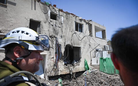 Security and rescue services at the scene where a drone fired from Iran hit and caused damage to a home in Beit She'an, June 21, 2025. (Michael Giladi/Flash90)