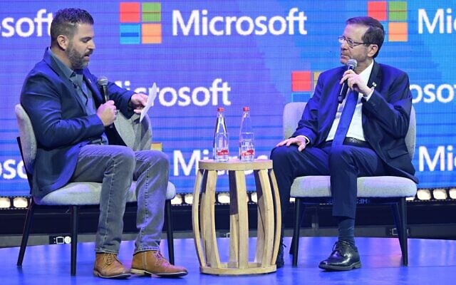 President Isaac Herzog (right) speaks at a Microsoft AI conference in Tel Aviv, June 3, 2025. (Haim Zach/GPO)