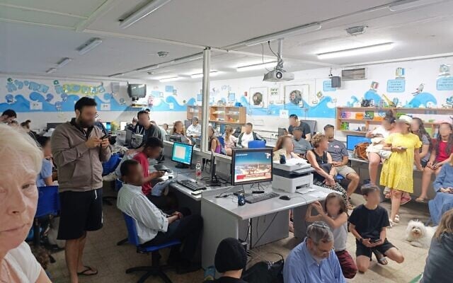 Residents shelter in a Jerusalem school during a missile attack, June 16, 2025.(Zev Stub/Times of Israel)