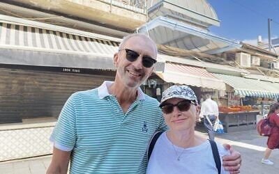 Victor and Susan Schmelzer at the Mahane Yehuda market in Jerusalem, June 24, 2025 (Zev Stub/Times of Israel)