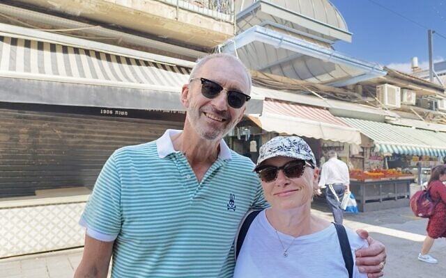 Victor and Susan Schmelzer at the Mahane Yehuda market in Jerusalem, June 24, 2025 (Zev Stub/Times of Israel)