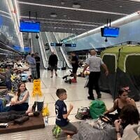 Residents seeking shelter from Iranian missile attacks in Ramat Gan's Bialik Light Rail Station, June 16, 2025. (Ariela Karmel)
