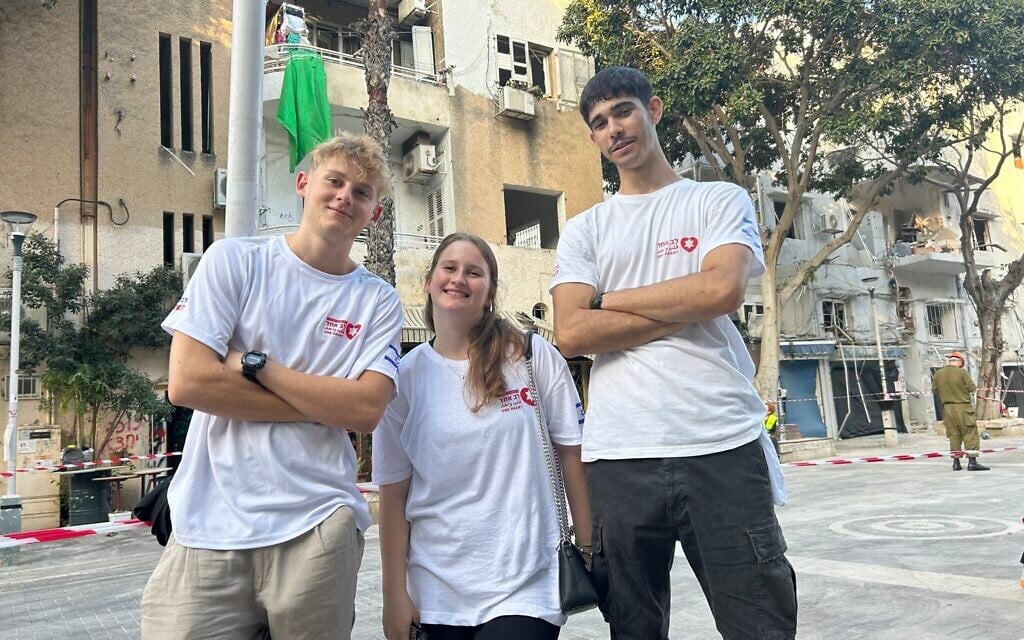 After the missiles explode, One Heart’s volunteers help residents pick up the pieces