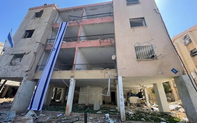 Remains of the building where the Rotstein family lived next to which an Iranian missile landed in the northern city of Haifa on June 15, 2025, photographed on June 16, 2025. (Sue Surkes/Times of Israel)