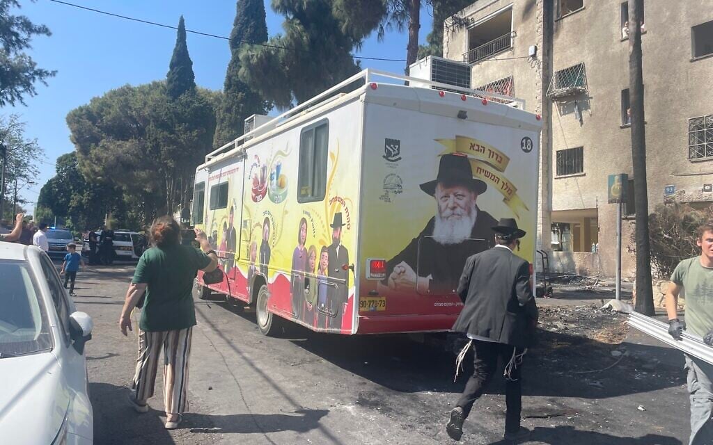 A Chabad bus issues prayers for the speedy recovery of people injured in an Iranian missile attack, for the defeat of the Iran-backed Hamas terror group, and the redemption of the People of Israel, in Haifa, northern Israel, June 16, 2025. (Sue Surkes/Times of Israel)