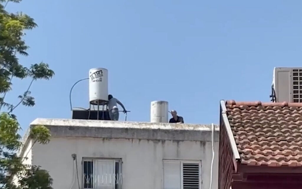 Man suspected of murdering mother jumps to his death from roof after police standoff