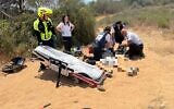 Magen David Adom medics attend to a 14-year-old boy who was injured apparently while playing with a gun, near Rishon Lezion, June 8, 2025. (MDA)